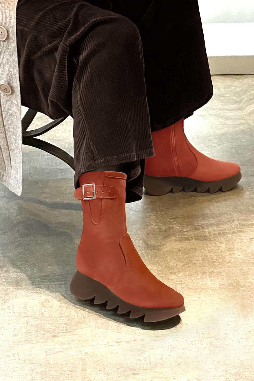 Terracotta orange women's ankle boots with a zip on the inside. Round toe. Low rubber soles. Worn view - Florence KOOIJMAN